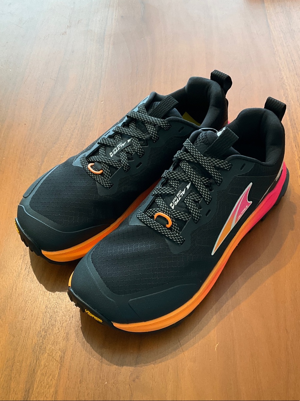 Lone Peak 9+ Altra Women's Black Running Shoes with Orange and Pink sample